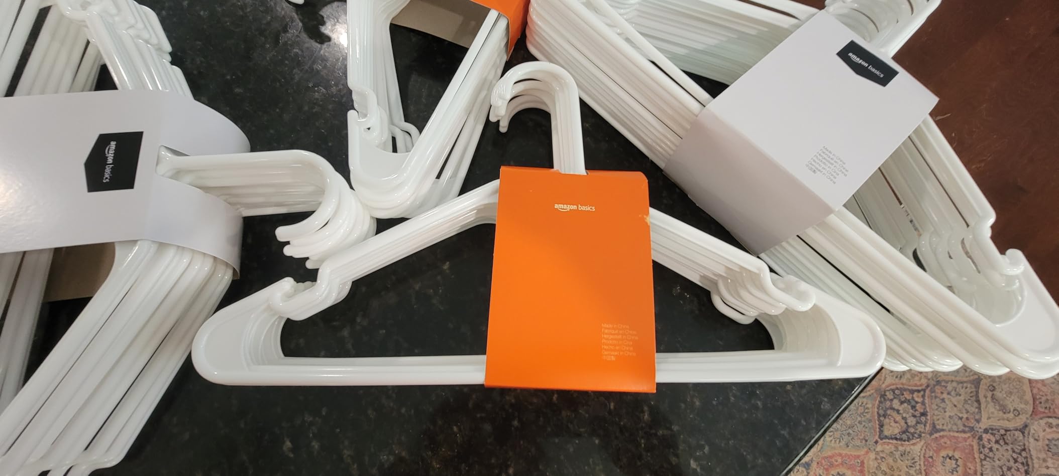 Amazon Basics Space Saving Plastic Clothes Hangers, Sturdy Closet Organizer for Shirts and Jackets, Adult Size, White, 50-Pack - Customer Photo 2