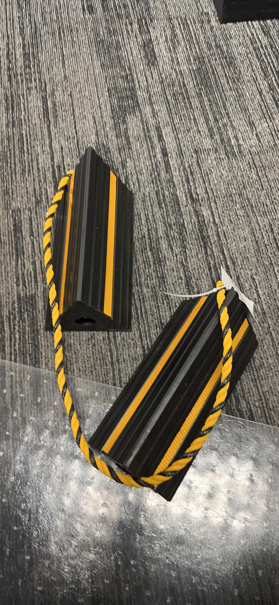 MaxxHaul 50019 Heavy Duty 3-Sided Rubber Wheel Chock with Yellow Reflective Strips and Nylon Rope and Non-Slip Base - 1 Pair customer photo 1