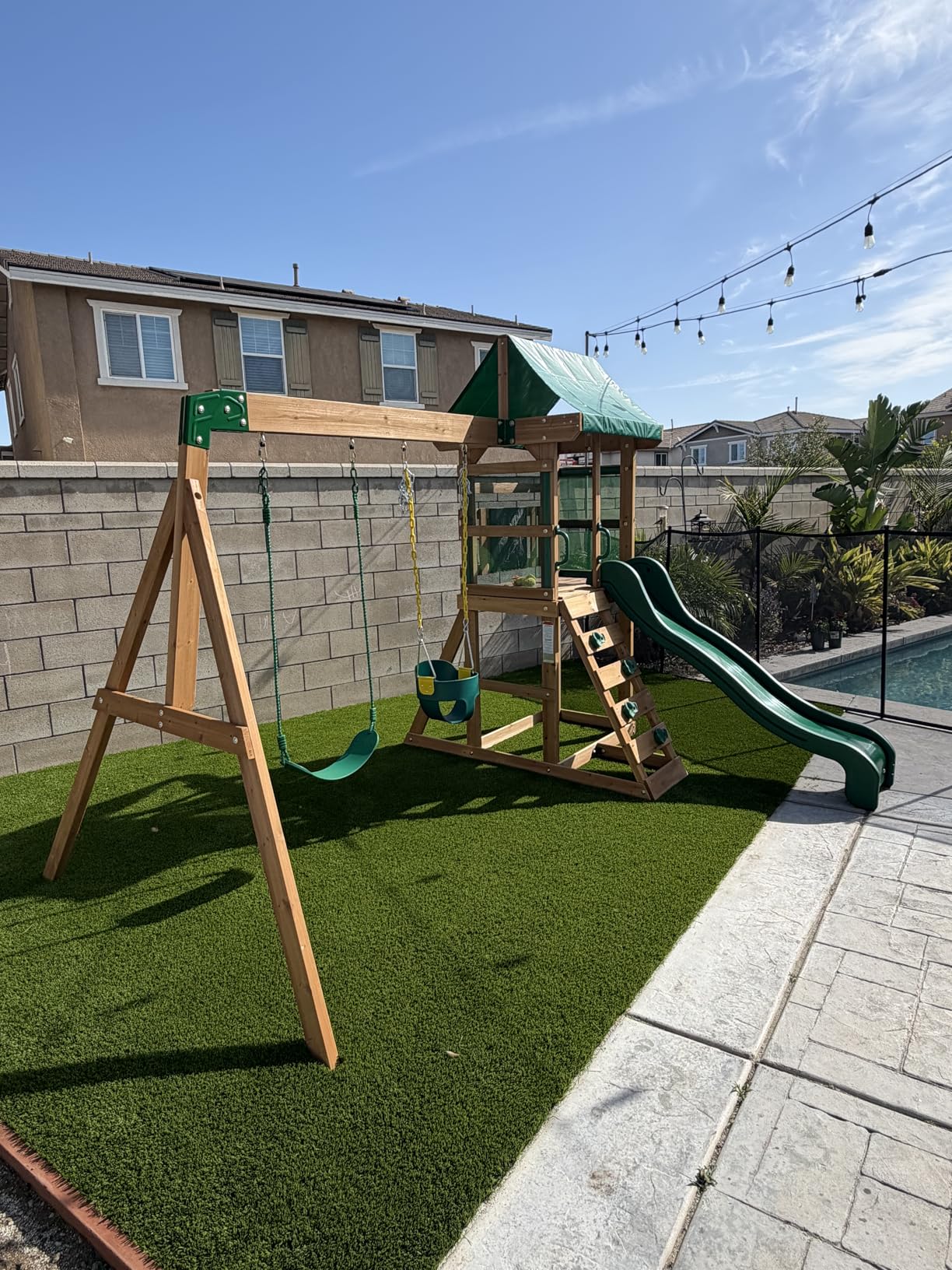 Backyard Discovery Buckley Hill Cedar Wood Swing Set with Wave Slide, Play Deck, Rock Wall Ladder, Belt Swings, Chalkboard, Canopy Roof, Outdoor Playset customer photo 2