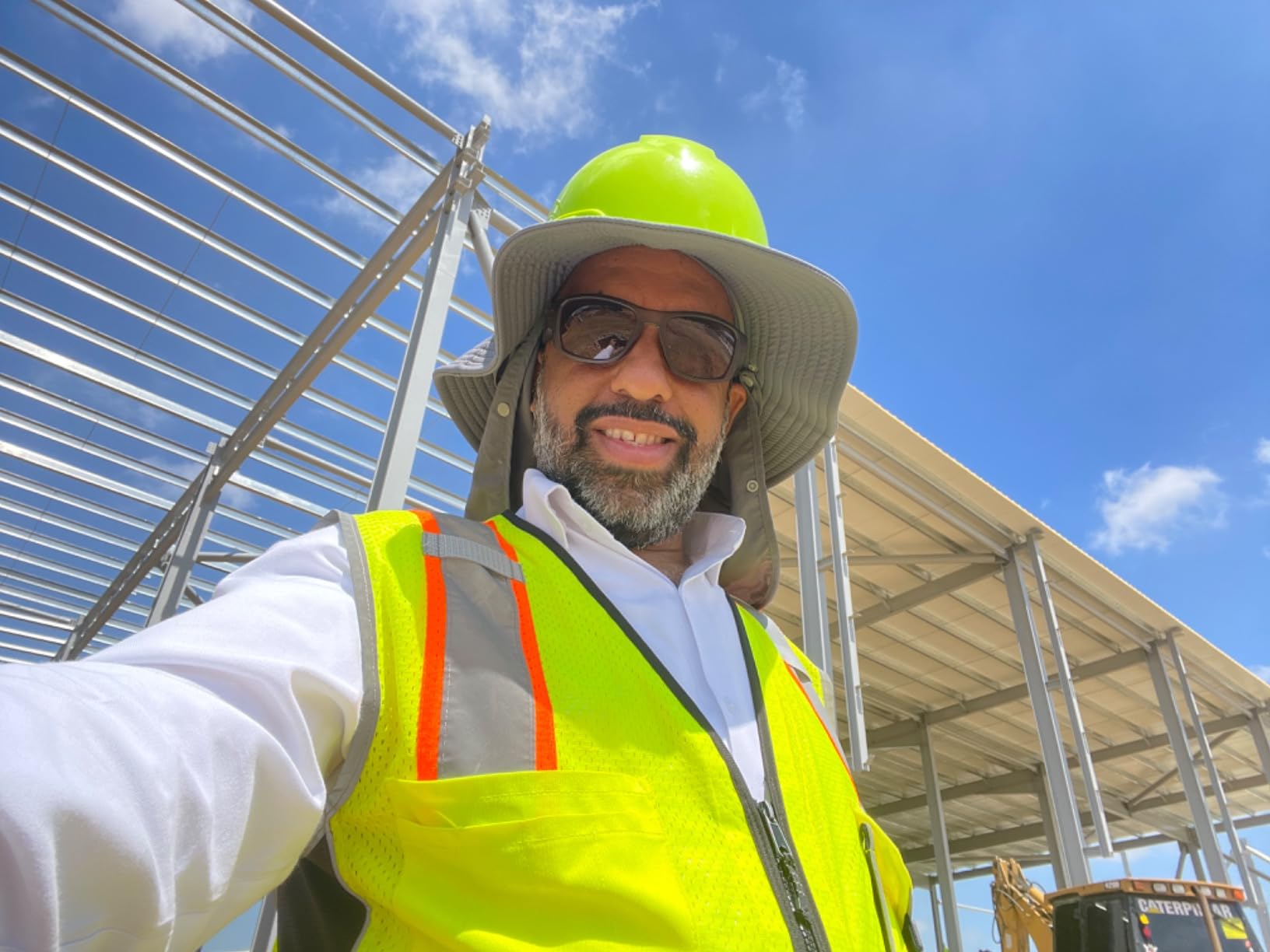 Kishigo Premium Black Series Heavy Duty Unisex Reflective Safety Vest 1514, ANSI Type R / Class 2 Compliant, 6 Pockets - Pencil & Radio Pockets, Reflective Silver Lining & Black Trim (Orange, XL) customer photo 1