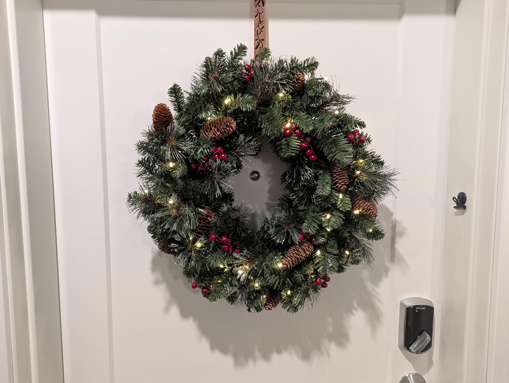 National Tree Company 24in Pre-Lit Crestwood Spruce Christmas Wreath | 50 Warm White LED Lights, 160 Tips, Artificial Christmas Decoration With Glitter, Pinecones, Red Berries, Timer, Green customer photo 2