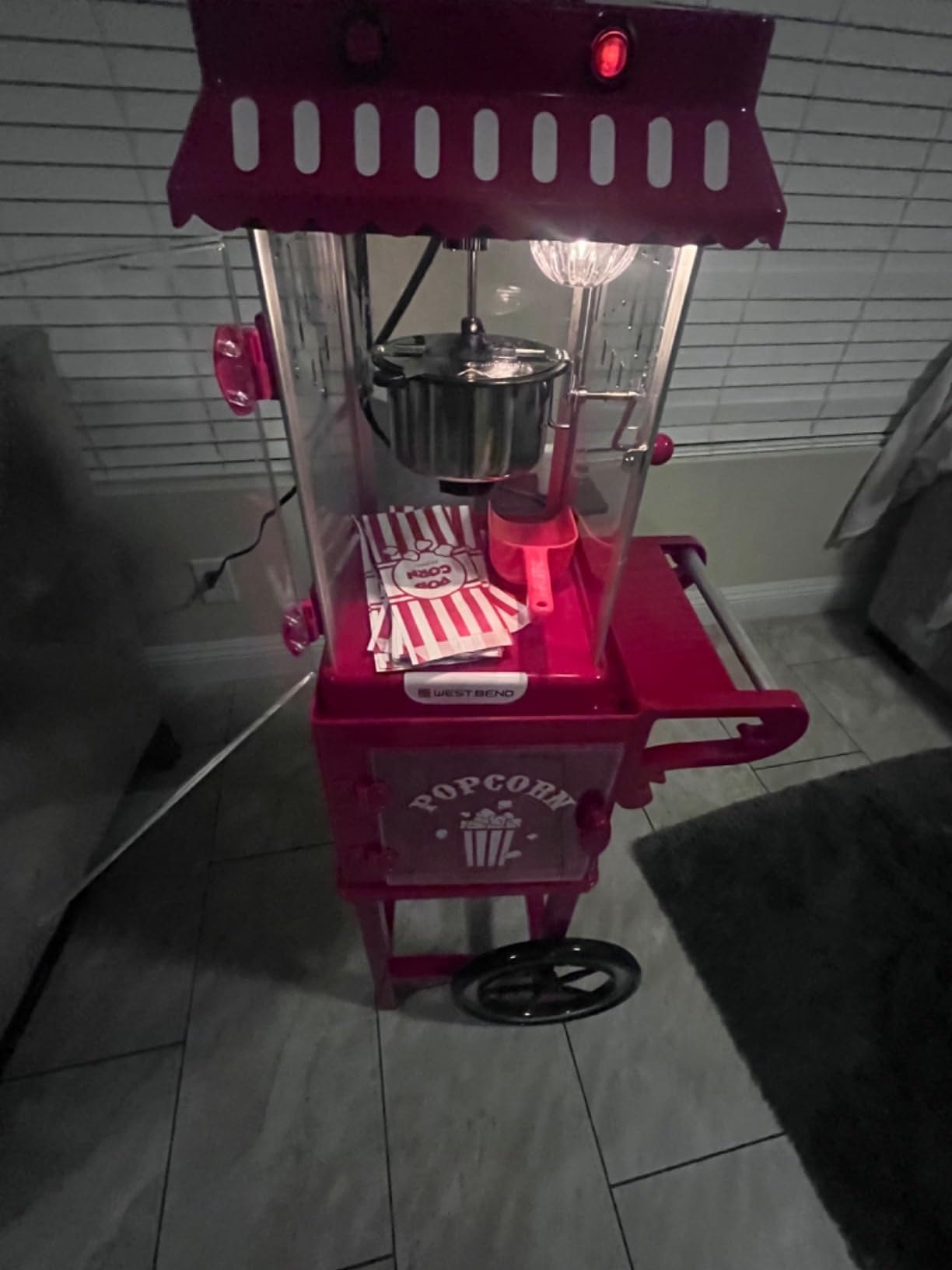 West Bend Popcorn Popper Machine Theater Style on Wheeled Cart with Non-Stick 2.5 Oz Stainless Steel Popcorn Kettle, Storage Shelf, and Popcorn Scoop, 10-Cup, Red customer photo 2