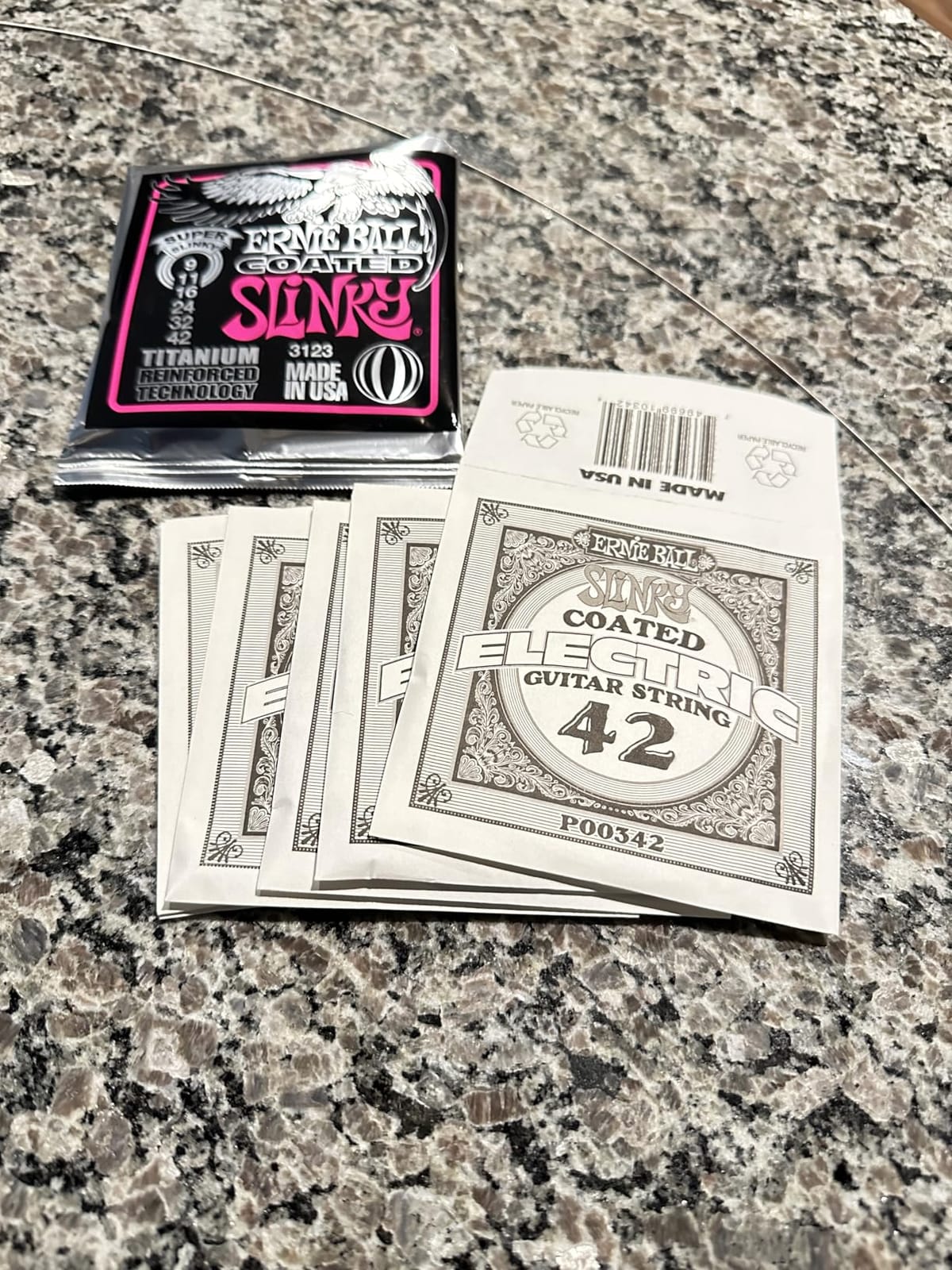 Ernie Ball Skinny Top Heavy Bottom Slinky Coated Titanium Electric Guitar Strings, 10-52 Gauge (P03115) customer photo 1